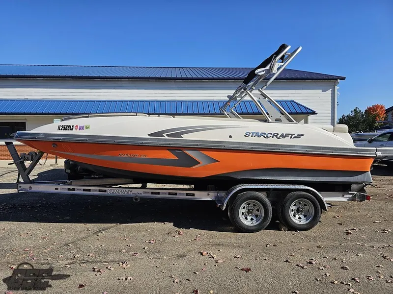Slide: The Image of 2018 Starcraft Star Step 221 I/O boat on a trailer, side view. - 1