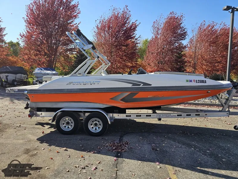 Slide: The Image of 2018 Starcraft Star Step 221 I/O boat on a trailer, parked outdoors in autumn. - 16