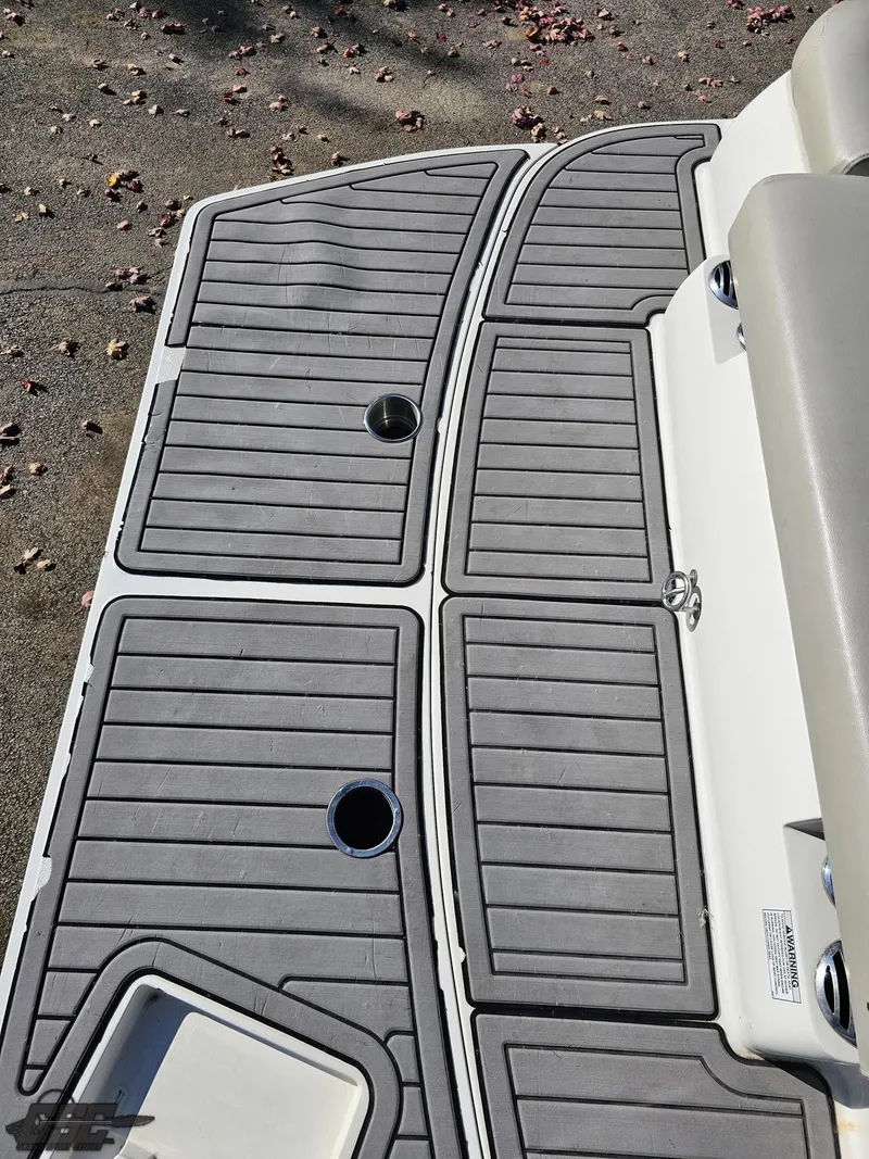 Slide: The Image of 2018 Starcraft Star Step 221 I/O boat deck with gray non-slip flooring. - 28