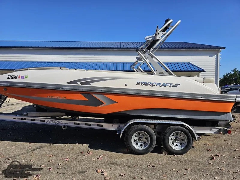 Slide: The Image of 2018 Starcraft Star Step 221 I/O boat on a trailer, side view. - 3