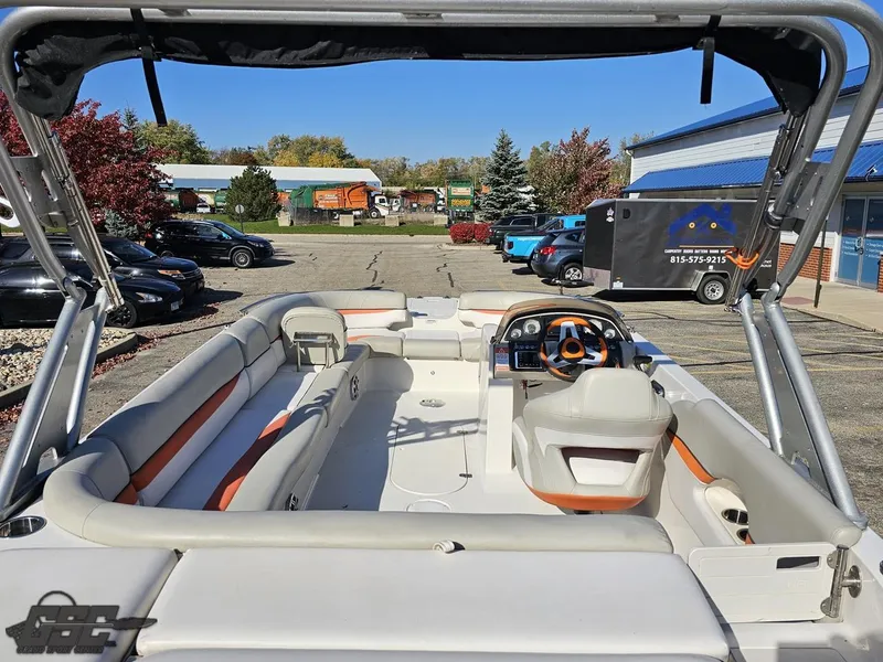 Slide: The Image of 2018 Starcraft Star Step 221 I/O boat interior with seating and steering console. - 30