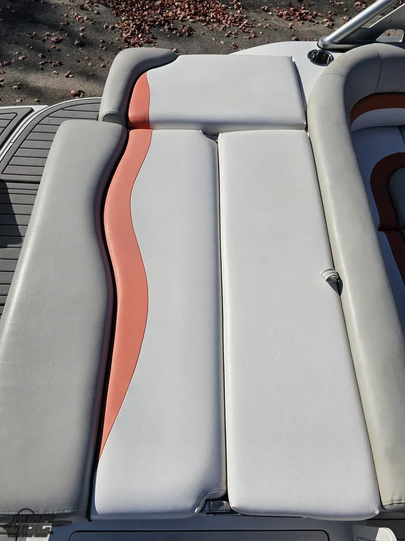 Slide: The Image of 2018 Starcraft Star Step 221 I/O boat seating with gray and orange upholstery. - 31
