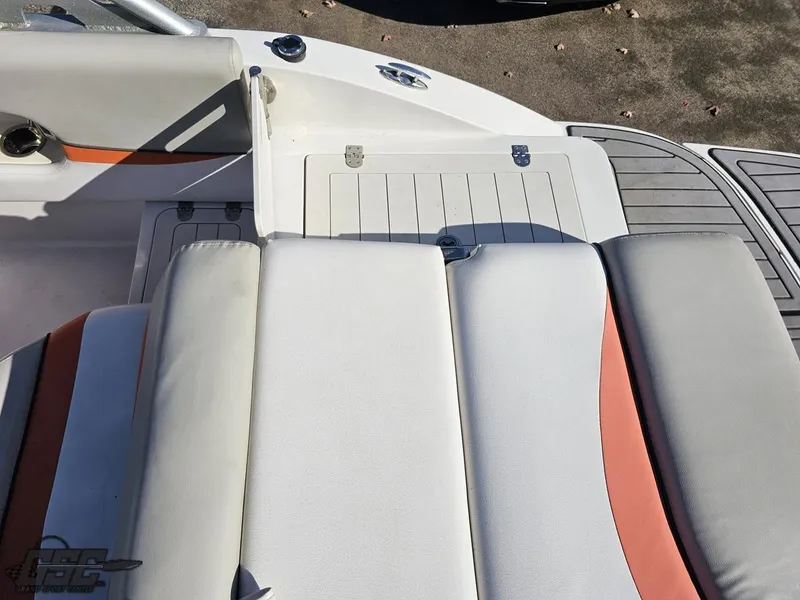 Slide: The Image of 2018 Starcraft Star Step 221 I/O boat interior with cushioned seating and storage compartment. - 34