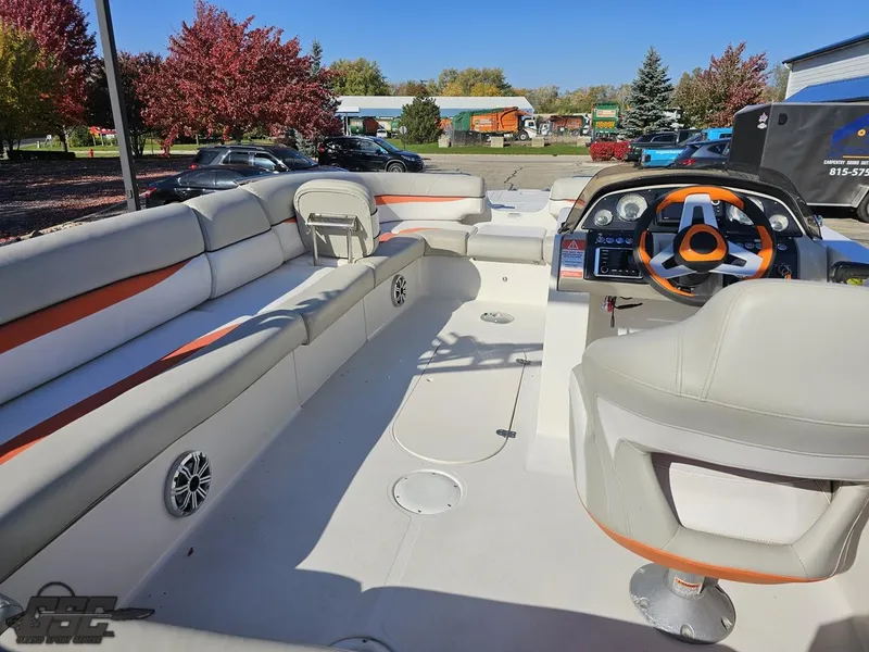 Slide: The Image of 2018 Starcraft Star Step 221 I/O boat interior with seating and steering console. - 35