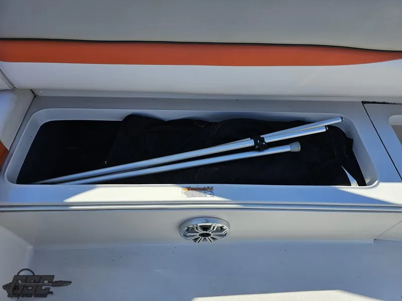 Slide: The Image of Storage compartment of a 2018 Starcraft Star Step 221 I/O boat with a folded canopy. - 41