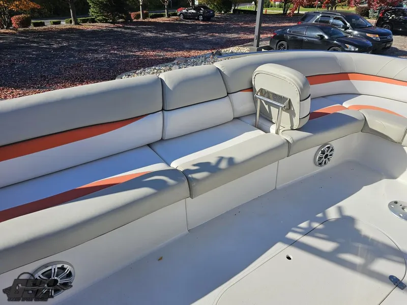 Slide: The Image of 2018 Starcraft Star Step 221 I/O boat interior with white and orange cushioned seating. - 43