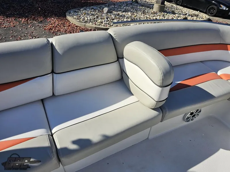 Slide: The Image of 2018 Starcraft Star Step 221 I/O boat interior with white and orange cushioned seating. - 44