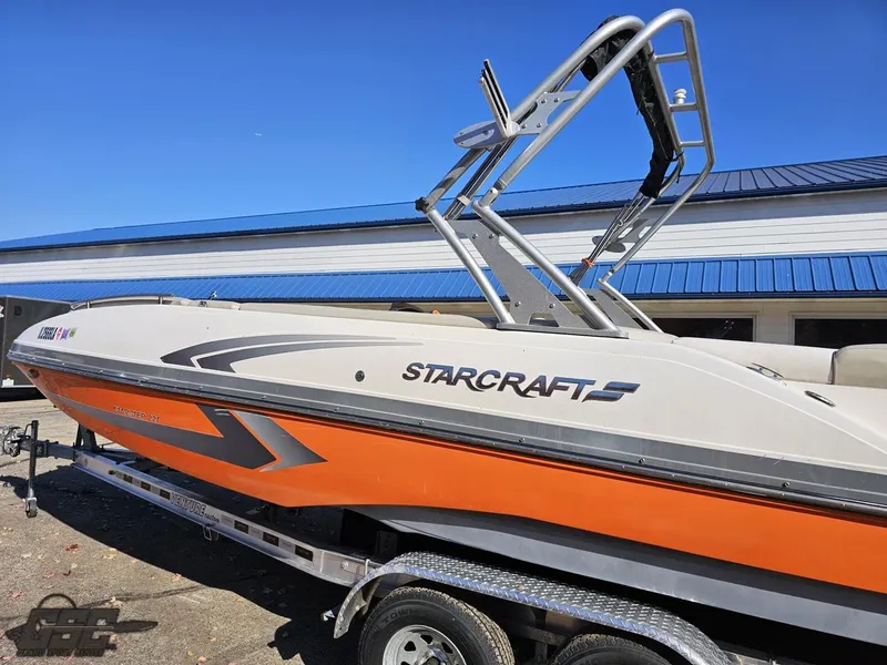 Slide: The Image of 2018 Starcraft Star Step 221 I/O boat on a trailer, side view. - 8