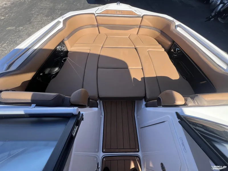 Slide: The Image of 2025 Yamaha Boats 275SD interior with tan seating and sleek design. - 2