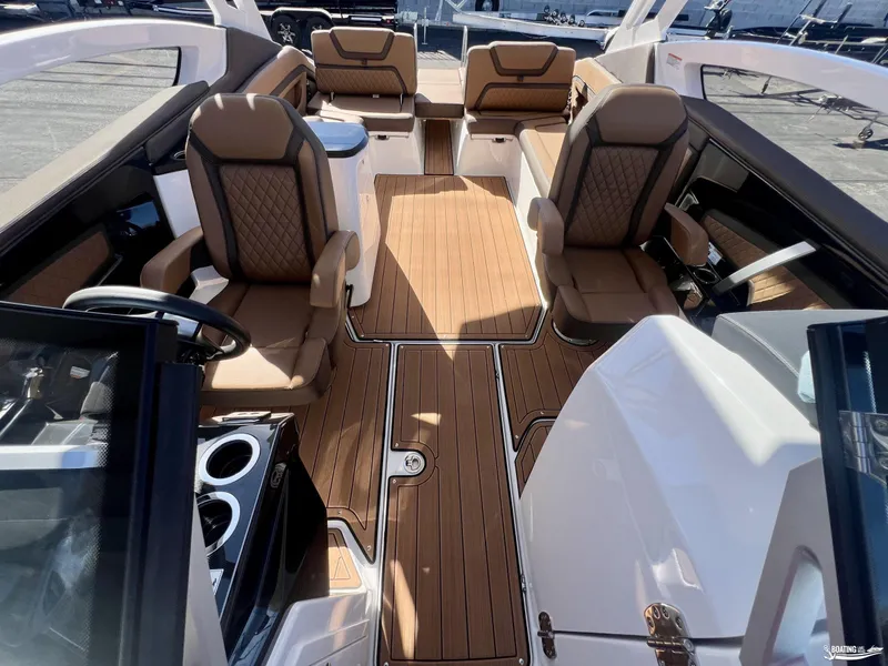 Slide: The Image of Luxurious interior of 2025 Yamaha Boats 275SD with elegant seating and wood flooring. - 3