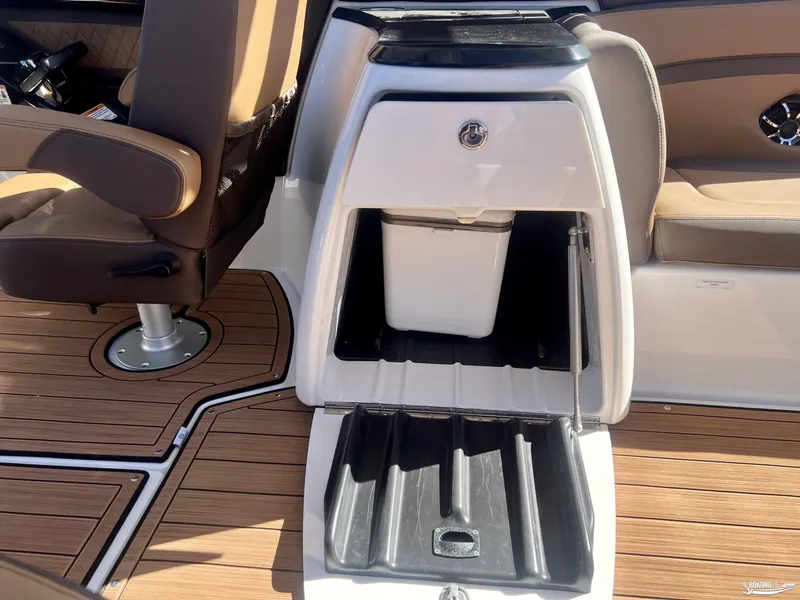 Slide: The Image of 2025 Yamaha Boats 275SD interior with storage compartment and seating. - 5