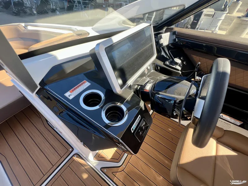 Slide: The Image of 2025 Yamaha Boats 275SD helm with touchscreen display and modern controls. - 6