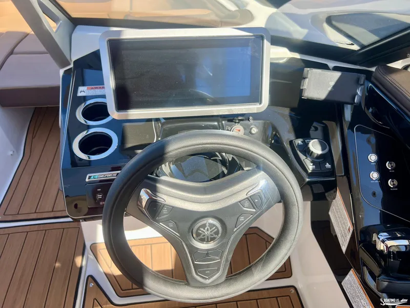 Slide: The Image of 2025 Yamaha Boats 275SD steering console with touchscreen and controls. - 7