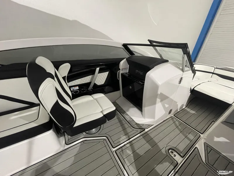 Slide: The Image of 2024 Yamaha Boats 275 SE interior with sleek seating and modern dashboard design. - 11