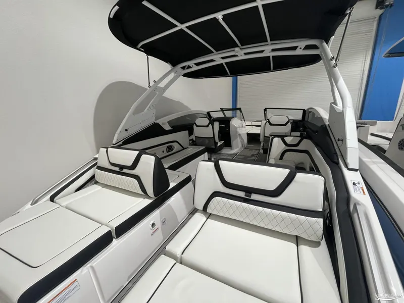 Slide: The Image of 2024 Yamaha Boats 275 SE interior with sleek white seating and black accents. - 3