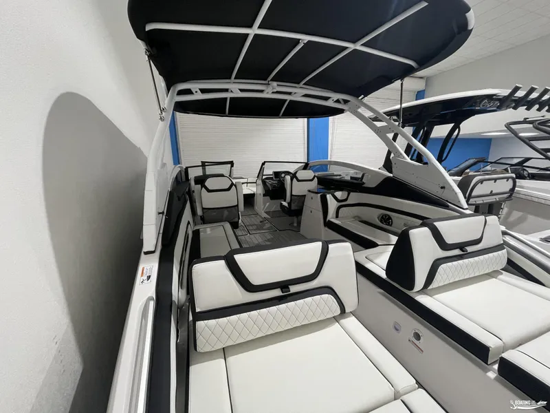 Slide: The Image of 2024 Yamaha Boats 275 SE interior with sleek white seating and black accents. - 4