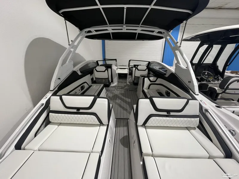 Slide: The Image of 2024 Yamaha Boats 275 SE interior with luxurious seating and sleek design. - 5