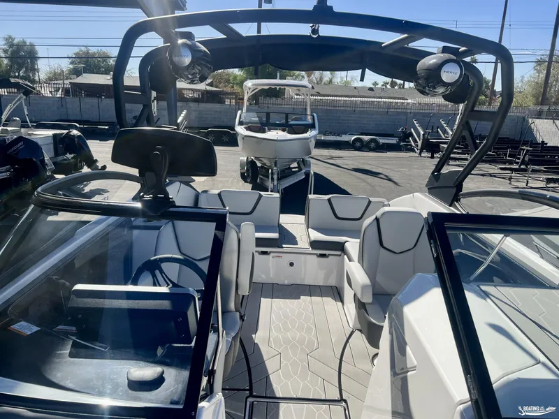 Slide: The Image of 2025 Yamaha Boats 252 XE interior with modern seating and sleek design. - 2