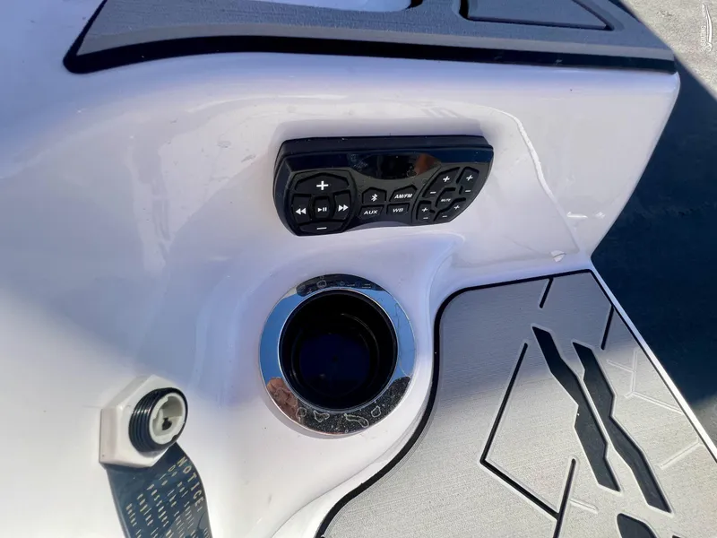 Slide: The Image of Yamaha Boats 2025 252 XE control panel and cup holder on deck. - 8