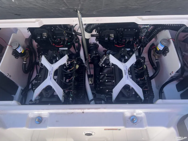 Slide: The Image of 2025 Yamaha Boats 252 XE engine compartment showcasing dual engines. - 9