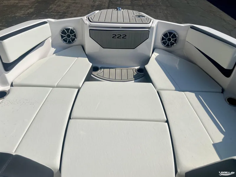 Slide: The Image of 2025 Yamaha Boats 222SE interior with white seating and speakers. - 3