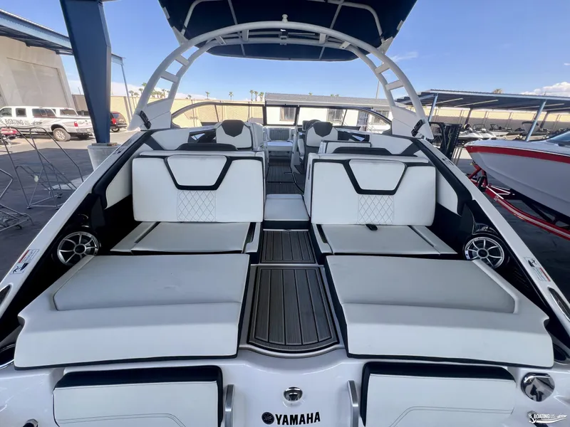 Slide: The Image of 2024 Yamaha Boats 252 SD interior with white seating and modern design. - 2