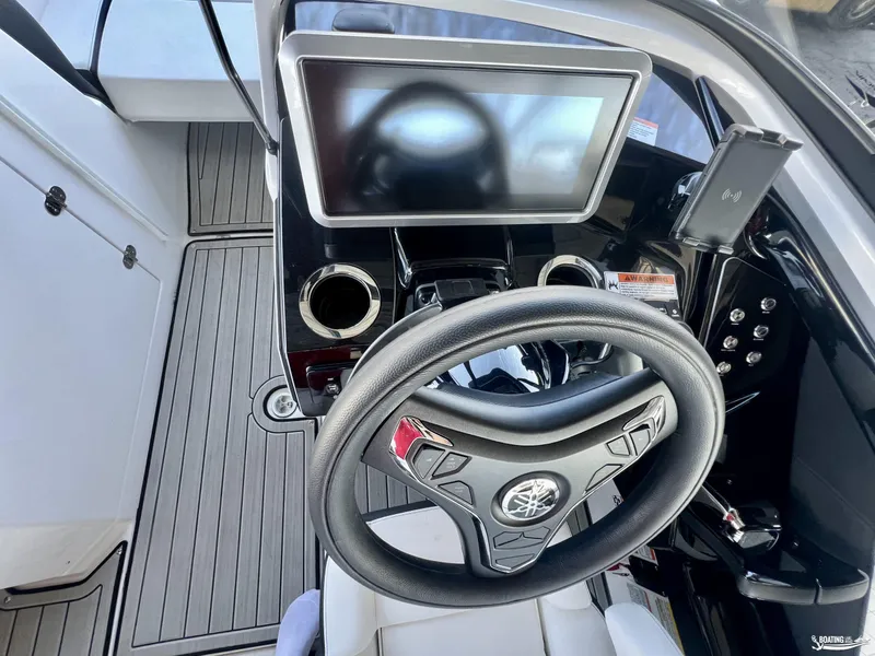 Slide: The Image of 2024 Yamaha Boats 252 SD helm with touchscreen display and modern steering wheel. - 5
