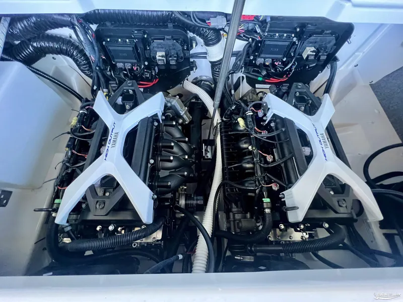 Slide: The Image of 2024 Yamaha Boats 252 SD engine compartment with dual high-output engines. - 6
