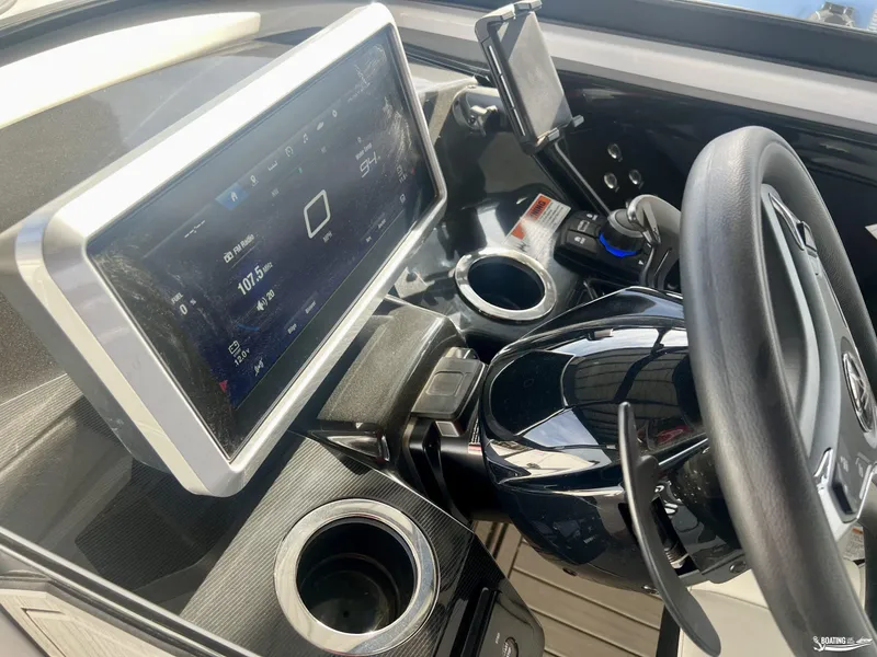 Slide: The Image of 2024 Yamaha Boats 252 SD dashboard with touchscreen display and steering wheel. - 9