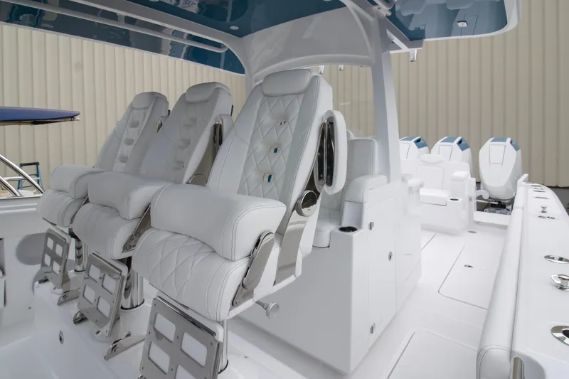 Slide: The Image of 2025 HCB 42 Lujo boat interior with luxurious white seating and modern design. - 14