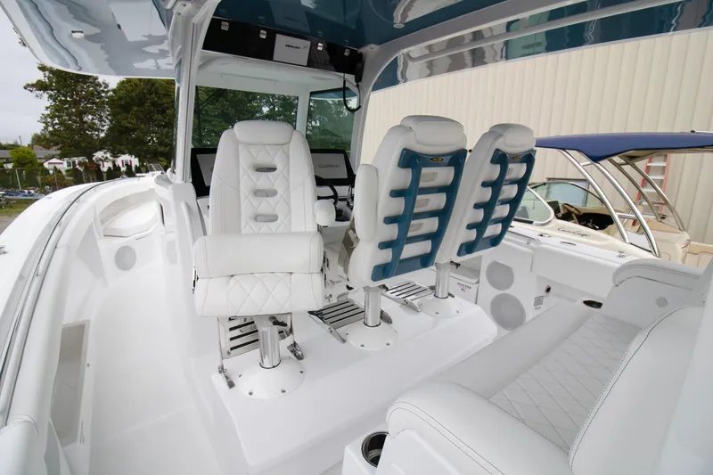 Slide: The Image of 2025 HCB 42 Lujo boat interior with luxurious white seating and modern design. - 16