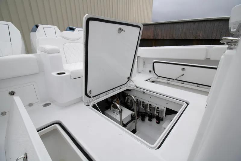 Slide: The Image of 2025 HCB 42 Lujo boat interior with open storage compartment. - 21