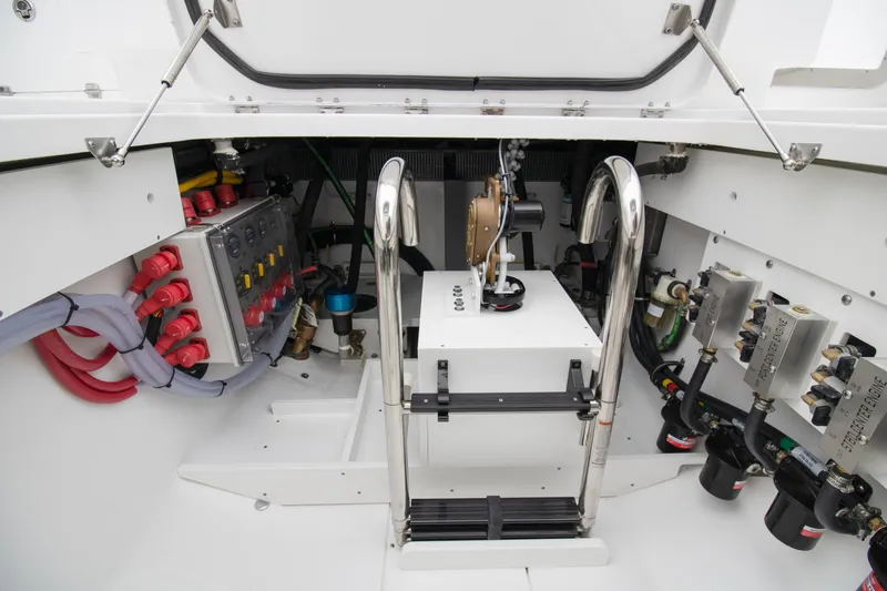 Slide: The Image of Engine compartment of 2025 HCB 42 Lujo boat, showcasing electrical systems and components. - 23