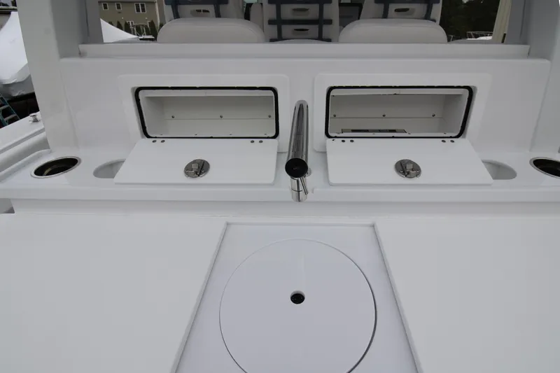 Slide: The Image of 2025 HCB 42 Lujo boat interior with storage compartments and sleek design. - 25