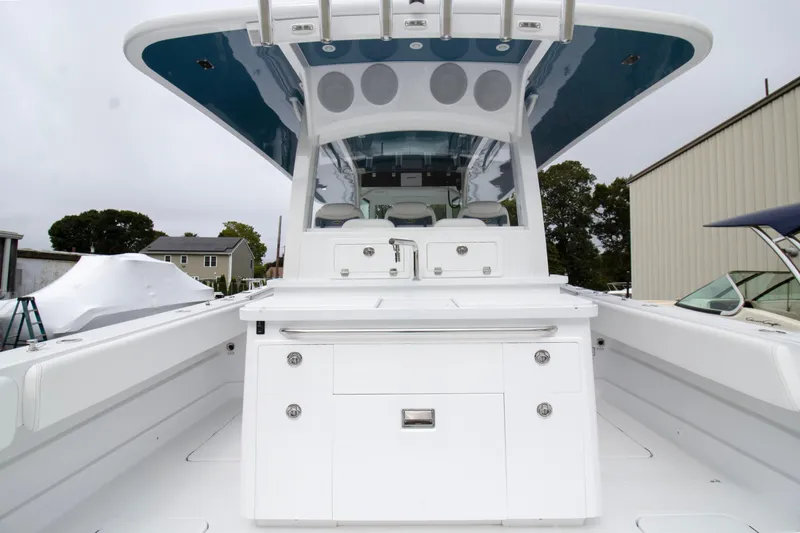 Slide: The Image of 2025 HCB 42 Lujo boat interior, featuring sleek white design and modern amenities. - 26