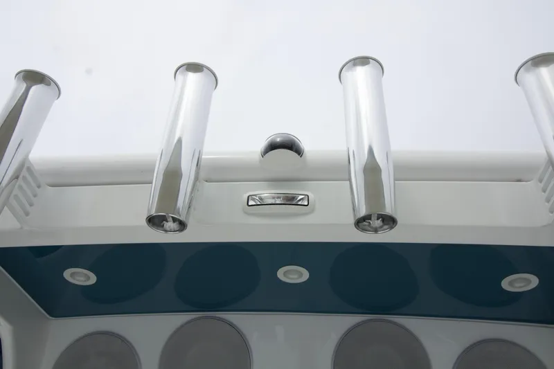 Slide: The Image of 2025 HCB 42 Lujo boat with sleek chrome rod holders and modern design elements. - 28