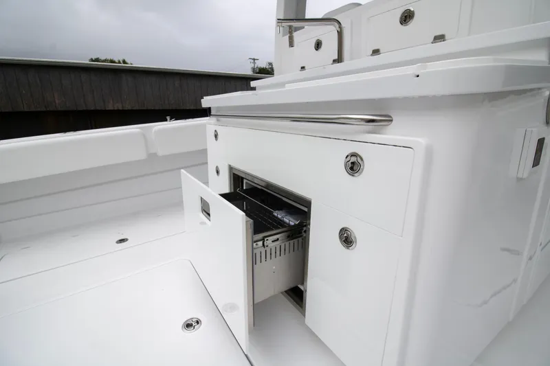 Slide: The Image of 2025 HCB 42 Lujo boat interior with open storage compartment. - 29