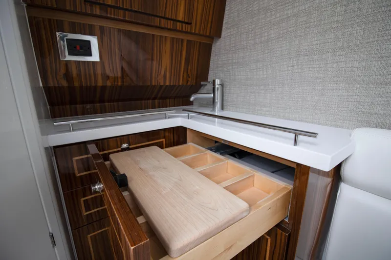 Slide: The Image of Interior of 2025 HCB 42 Lujo yacht with open wooden drawer and modern design. - 32