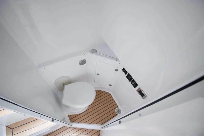Slide: The Image of 2025 HCB 42 Lujo boat interior bathroom with modern fixtures and wooden flooring. - 35