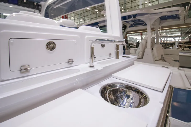 Slide: The Image of 2025 HCB 42 Lujo boat interior with sleek sink and storage features. - 47