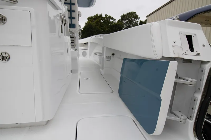 Slide: The Image of 2025 HCB 42 Lujo boat interior with sleek white and blue design elements. - 8