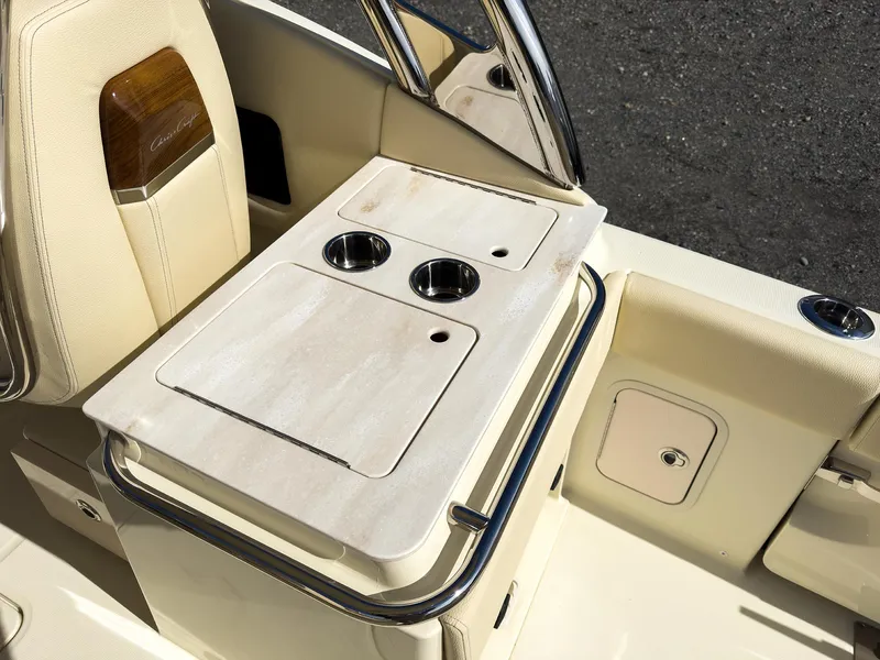 Slide: The Image of 2024 Chris-Craft 24 CALYPSO boat interior with cup holders and storage compartments. - 13