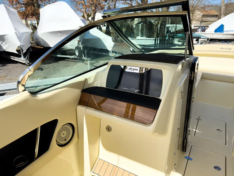 Slide: The Image of 2024 Chris-Craft 24 CALYPSO boat interior with seating and dashboard. - 20