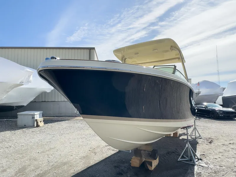 Slide: The Image of 2024 Chris-Craft 24 CALYPSO boat on stands in a boatyard. - 21