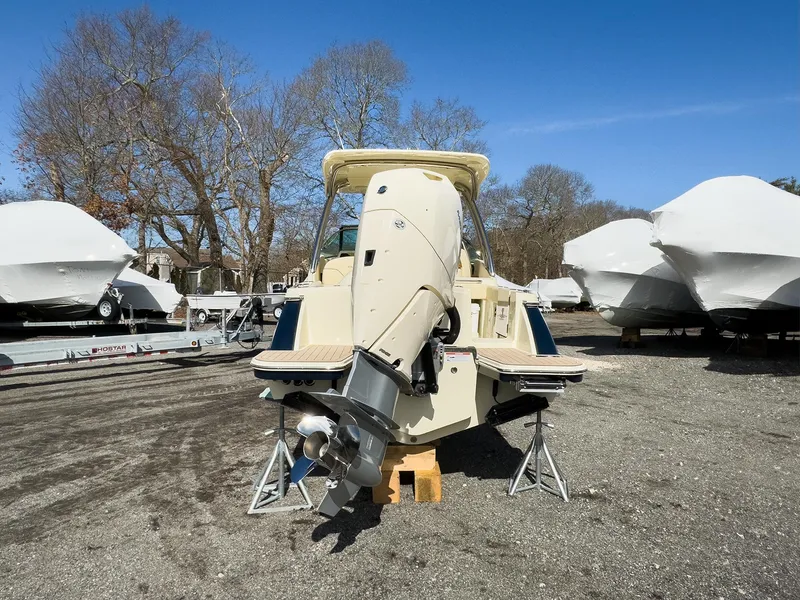 Slide: The Image of 2024 Chris-Craft 24 CALYPSO boat with outboard motor in storage yard. - 23
