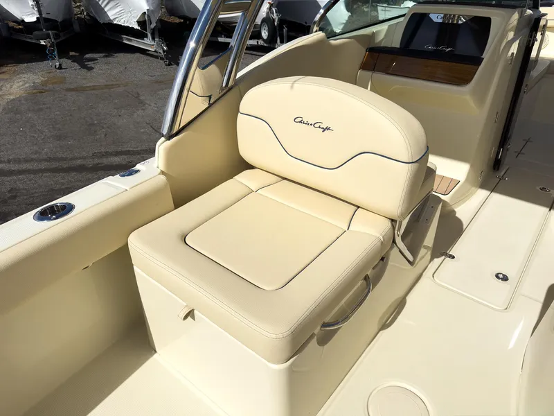 Slide: The Image of 2024 Chris-Craft 24 CALYPSO boat with beige cushioned seating. - 5
