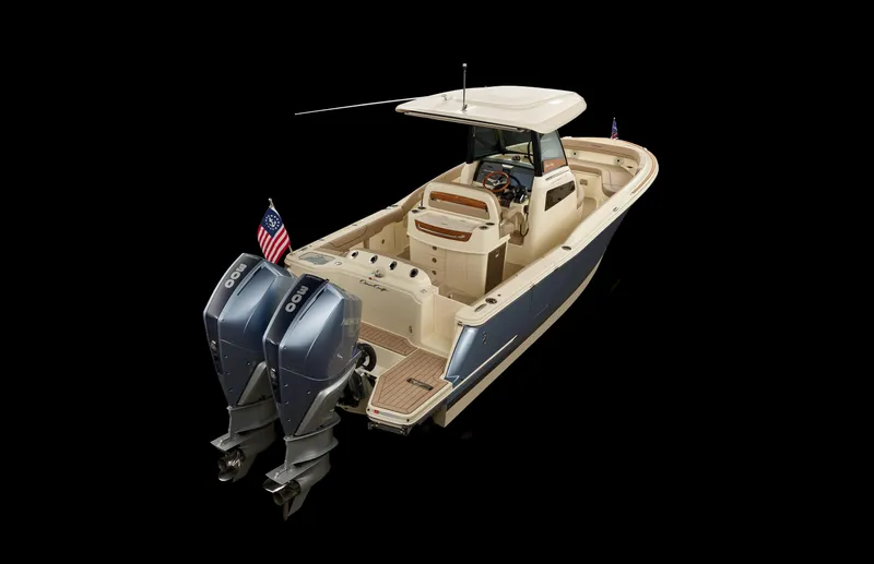 Slide: The Image of 2024 Chris-Craft Catalina boat with dual outboard engines, sleek design, and American flags. - 16
