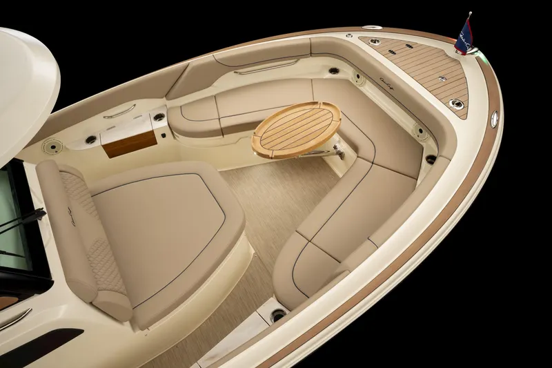 Slide: The Image of Luxurious 2024 Chris-Craft Catalina boat interior with elegant seating and wooden table. - 18
