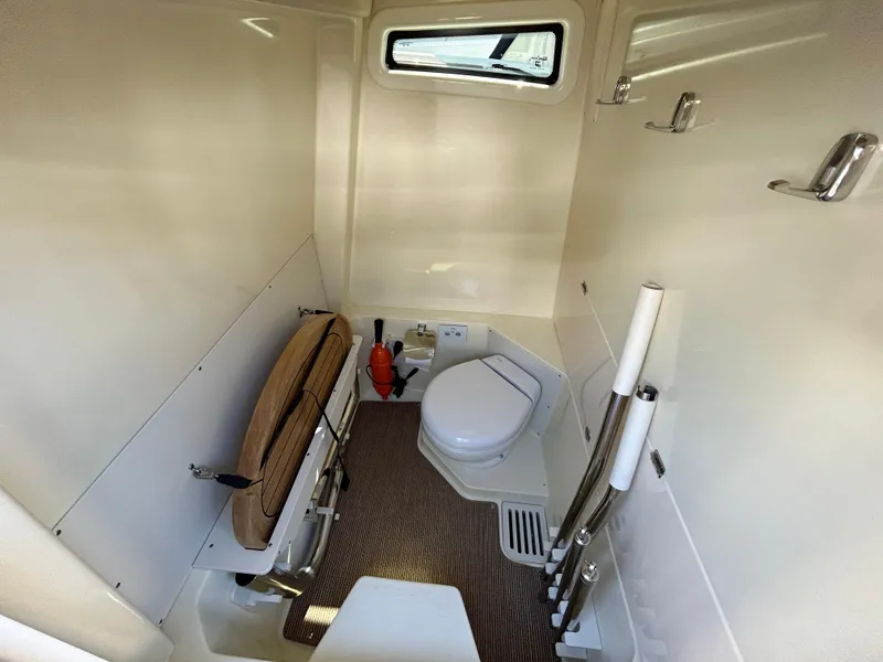Slide: The Image of 2024 Chris-Craft Catalina boat interior with compact bathroom and modern amenities. - 5
