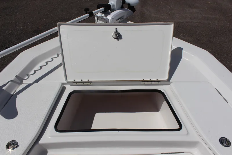 Slide: The Image of 2024 Blue Wave 2200 STL boat with open storage compartment. - 12